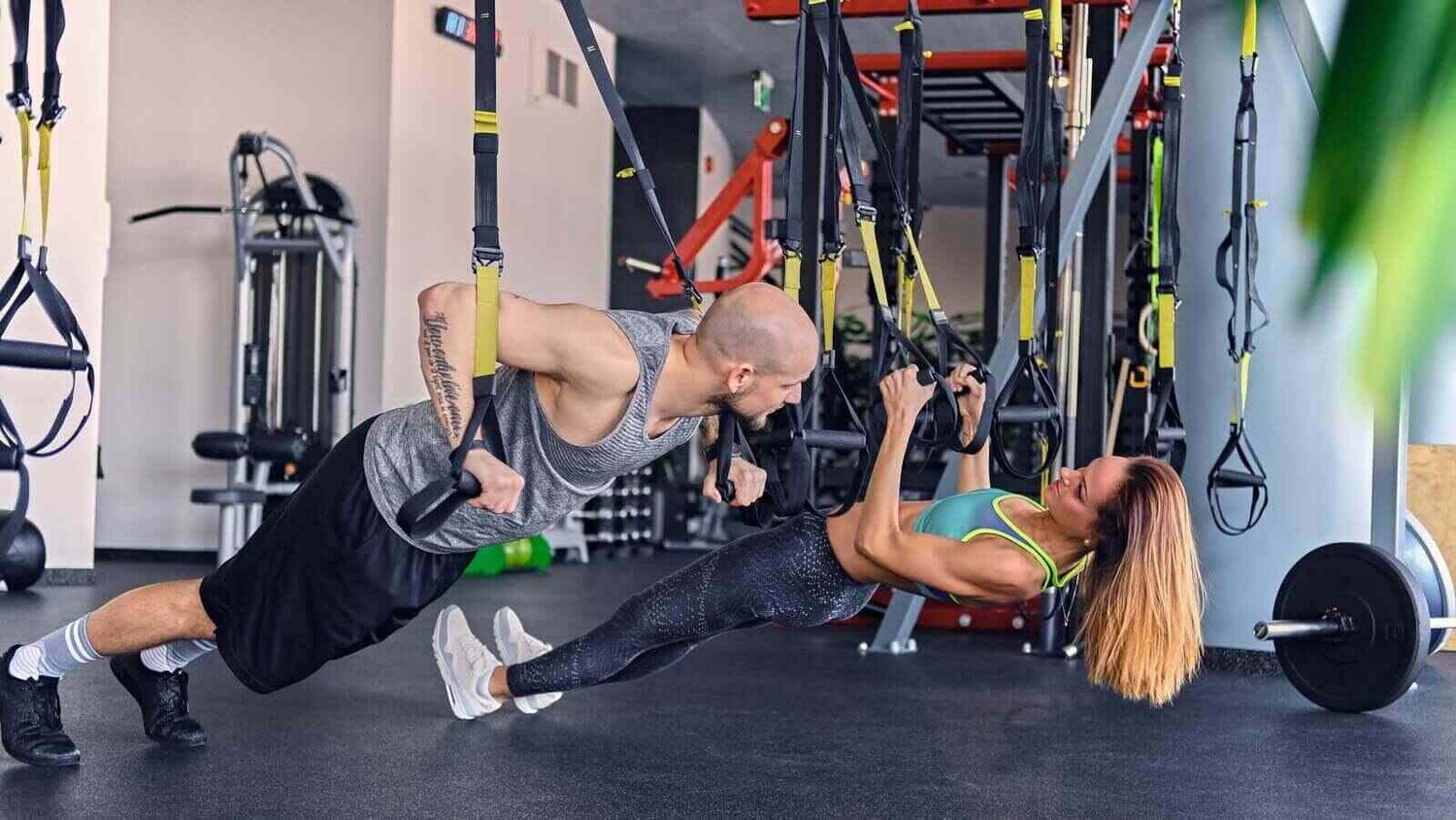 Fitness Woman Workout on TRX Straps in Gym. Crossfit Style